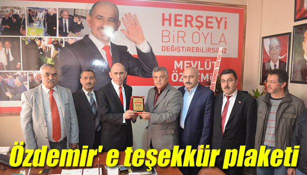 ÖZDEMİR' E TEŞEKKÜR PLAKETİ