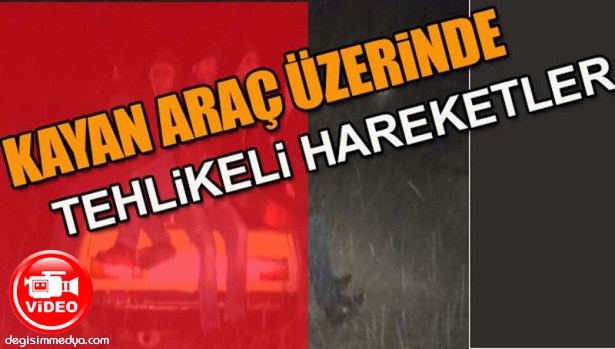 KAYAN OTOMOBİL ÜZERİNDEKİ TEHLİKELİ YOLCULUK KAMERADA
