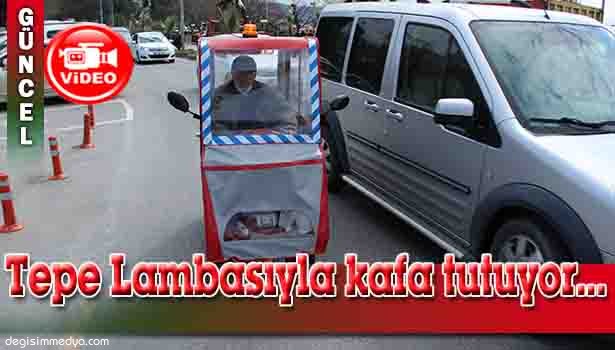 ENGELLİ VATANDAŞ, TEPE LAMBASI VE SİRENİ İLE OTOMOBİLLERE KAFA TUTUYOR