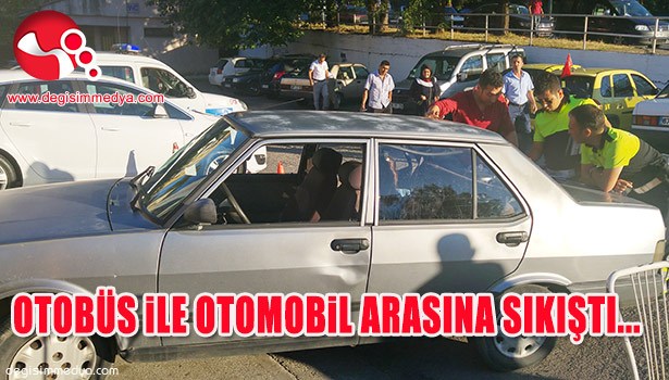 OTOMOBİLİ İLE OTOBÜSÜN ARASINA SIKIŞTI