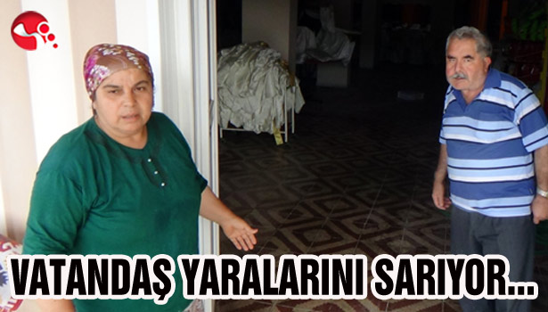 VATANDAŞ YARALARINI SARIYOR...