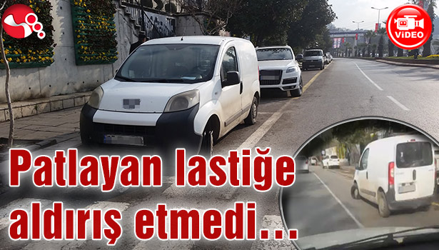 Patlayan lastiğe aldırış etmedi...