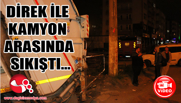 Kamyon ile direk arasında sıkıştı...