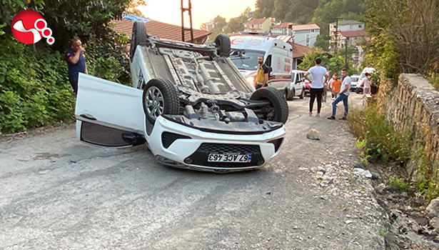 Takla atan araçtan yara almadan kurtuldular