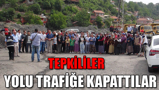 ASFALTLANMAYAN YOLU TRAFİĞE KAPATTILAR