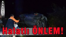 DERE KENARINA DEVRİLEN OTOMOBİLE HALATLI ÖNLEM